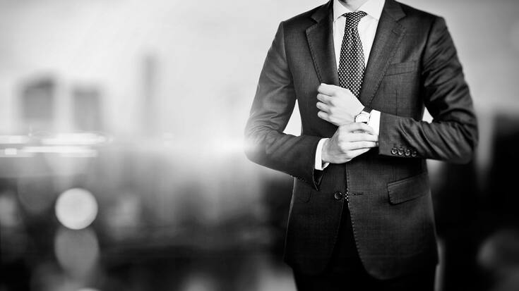 BW picture of young business man on a blured background