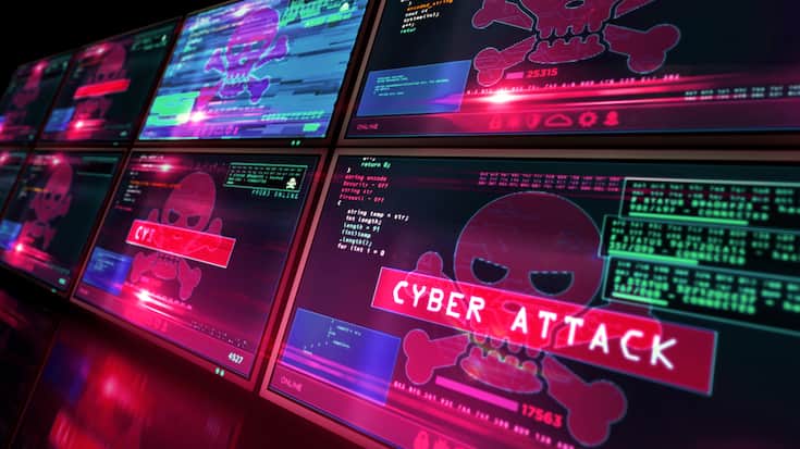 Cyber attack with skull symbol alert on screen