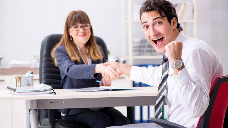 Man and woman discussing in office