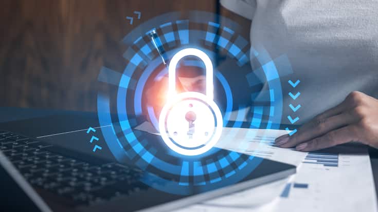 IT-Sicherheit.Woman signs agreement. Lock icon hologram. Double exposure.