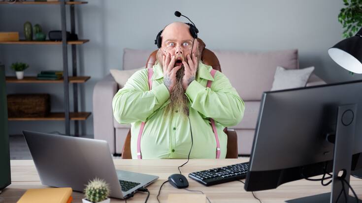 Portrait of attractive angry mad guy answering client calls hot 